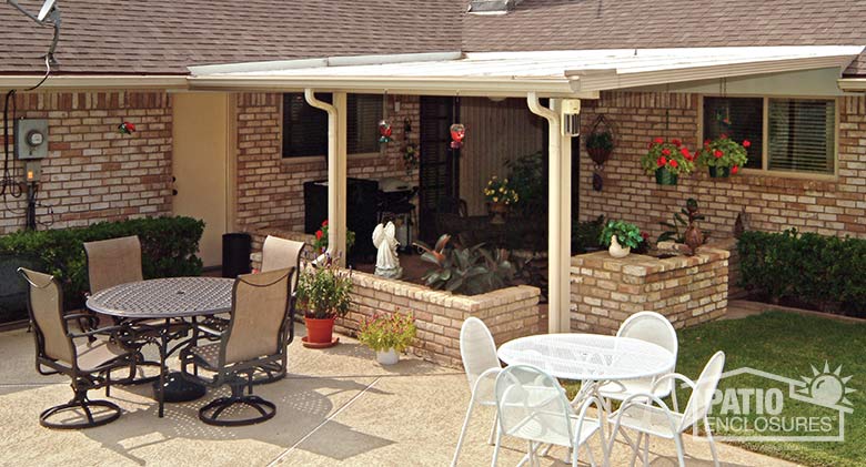 Sandstone patio cover with existing knee wall planters creates an outdoor “room