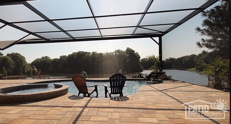 Screened pool enclosure with extreme view in bronze.